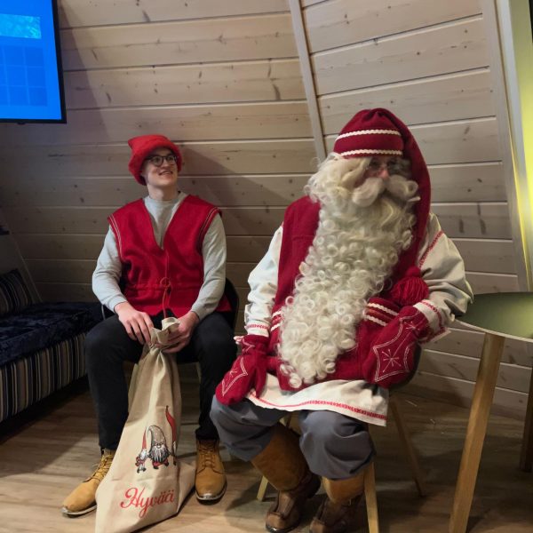 Santa with assistant in Saariselka, Finland. Arriving in Santa Claus Village