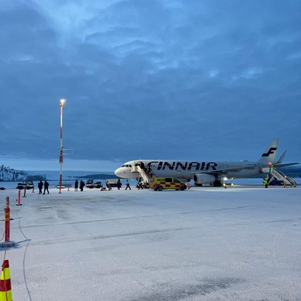 Passengers disembarking from plane at airport in Ivalo, Finland. The truth about Kakslauttanen Arctic resort