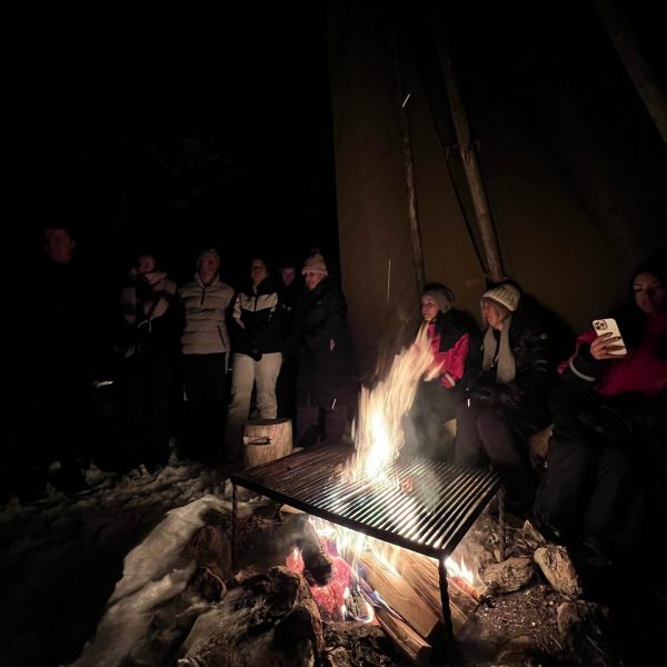 People around the fire in Saariselka, Finland. Arriving in Santa Claus Village