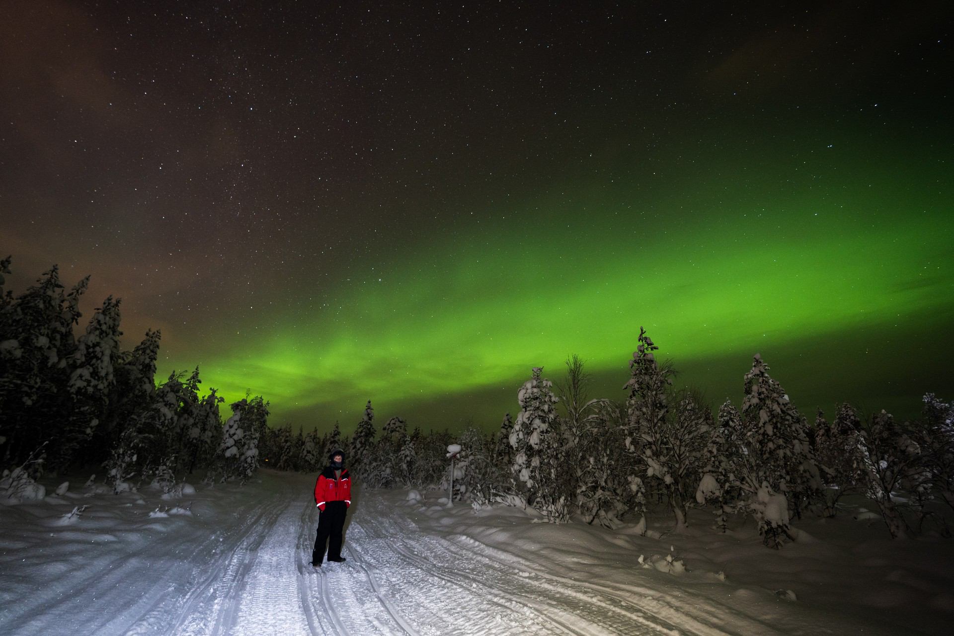 David Simpson and the northern lights in Rovaniemi, Finland. Christmas Day in Lapland