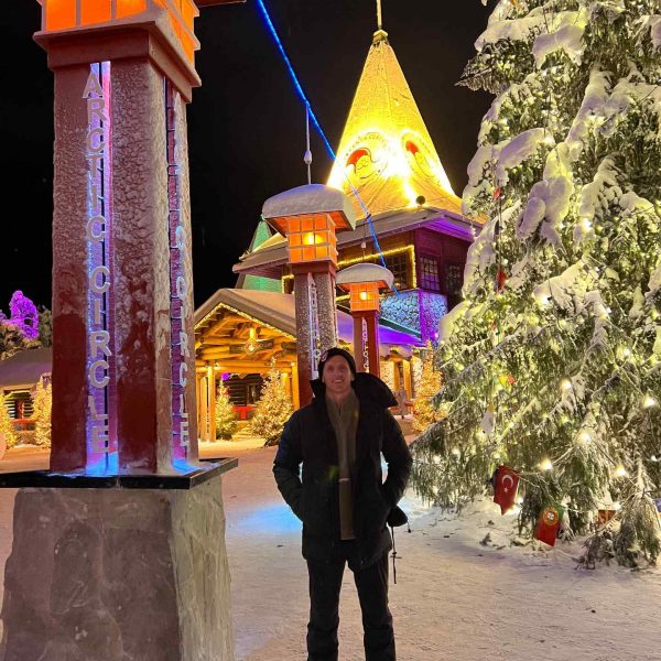 David Simpson and giant christmas tree in Rovaniemi, Finland. Christmas Day in Lapland
