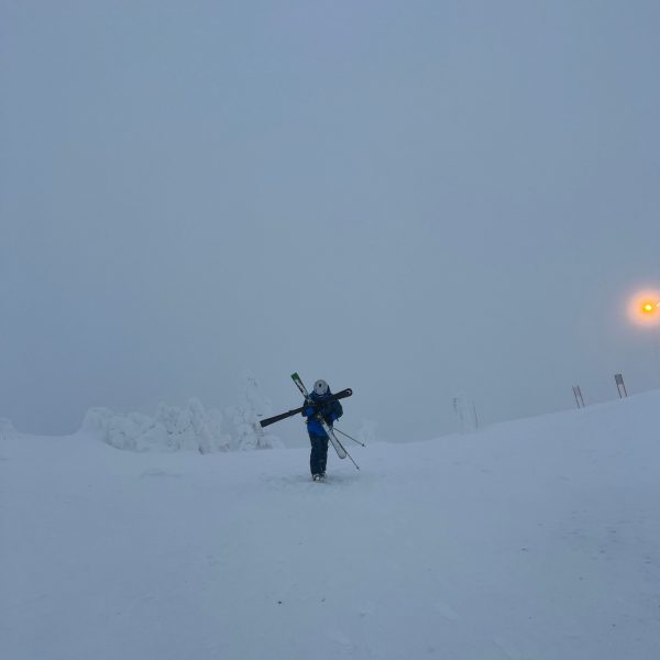 Skier standing in the snow in Ruka, Finland. Reindeer yoga, vengeance & NYE