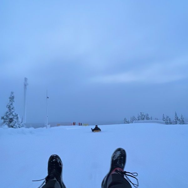 Tobogganing in Saariselka, Finland. Jumping in an ice lake with mum & dad
