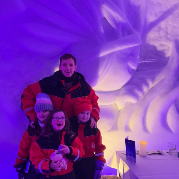 David Simpson and nieces by the ice sculpture in Rovaniemi, Finland. Christmas Day in Lapland