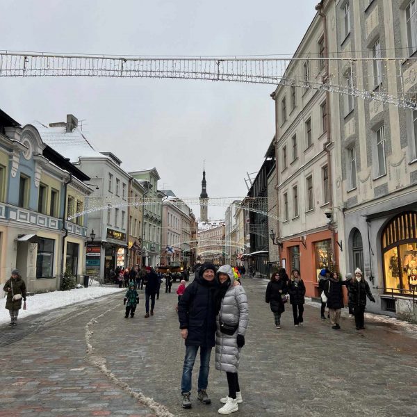Mom and dad on the street in Tallinn, Estonia. Day trip to magical Tallinn