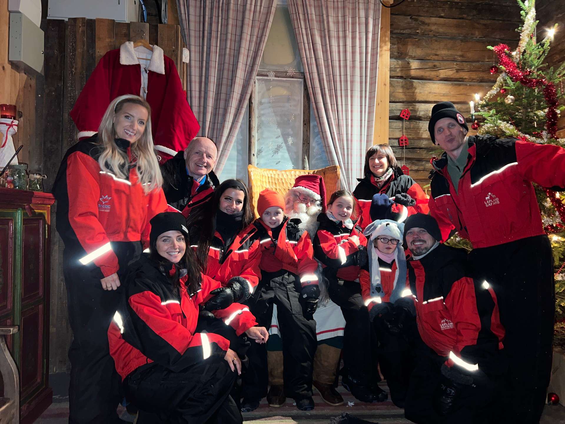 Davis Simpson and family with Santa in Saariselka, Finland. Arriving in Santa Claus Village
