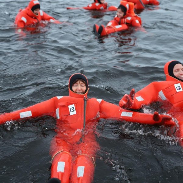 David Simpson and family floating in water in Kemi, Finland. The Polar Explorer Icebreaker, Sweden