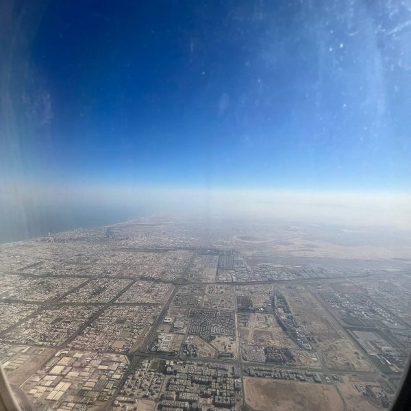 Plane window view in Dubai, UAE. Dubai’s worst hotel