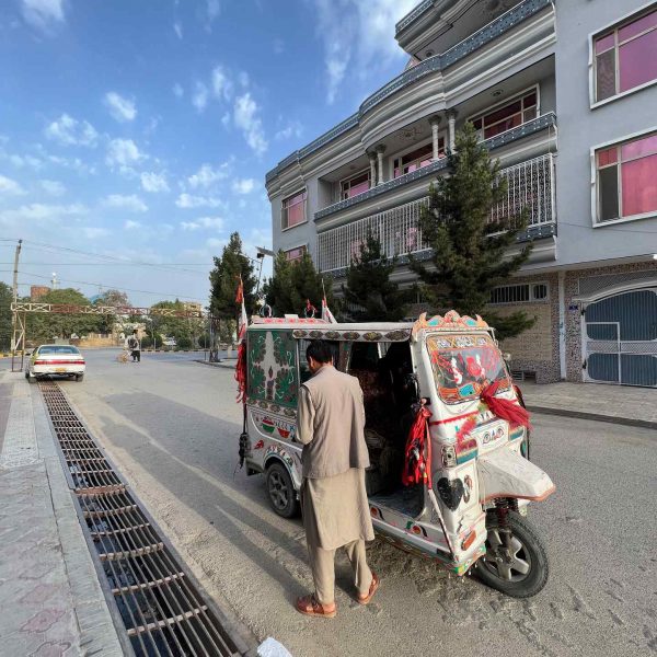 Tuktuk and local guy in Mazar, Afghanistan. Playing volley ball with the Taliban