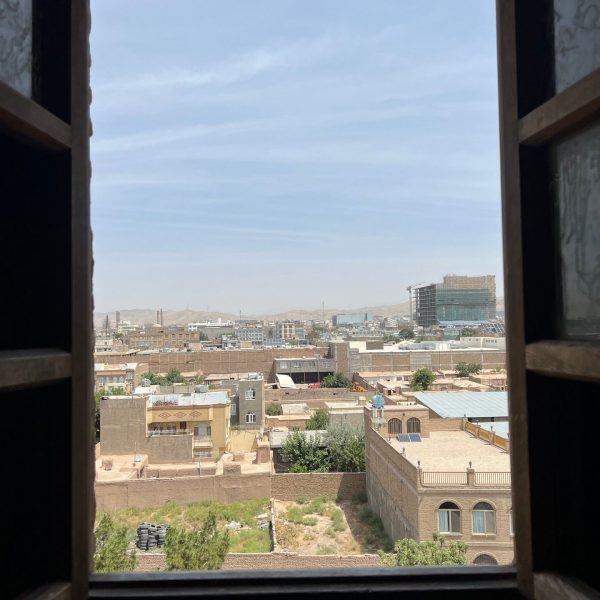Window overlooking city in Herat, Afghanistan. Camels, rolling & sleep ‘n fly