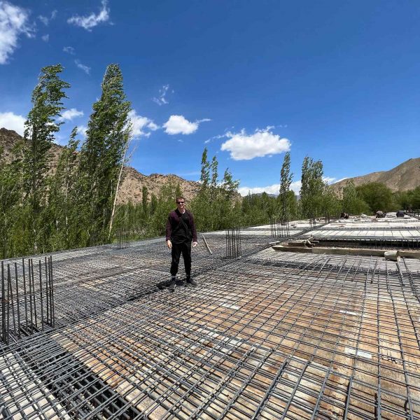David Simpson standing on construction site in Bamiyan, Afghanistan. Bamiyan, Qlukhi & The Buddhas