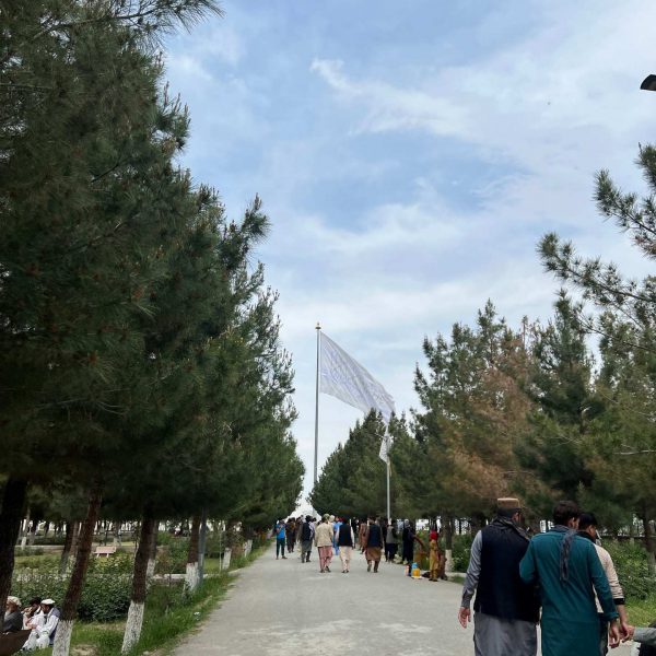 Local people attending flag ceremony in Kabul, Afghanistan. Crazy friday flag with Afghan locals