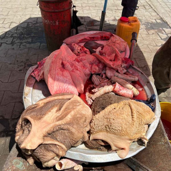 Meat at butcher shop in Herat, Afghanistan. Camels, rolling & sleep ‘n fly