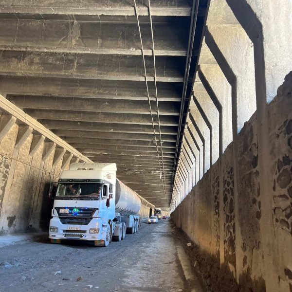 Trucks passing tunnel in Mazar, Afghanistan. Body search, Soviet exploits & The Salang Pass