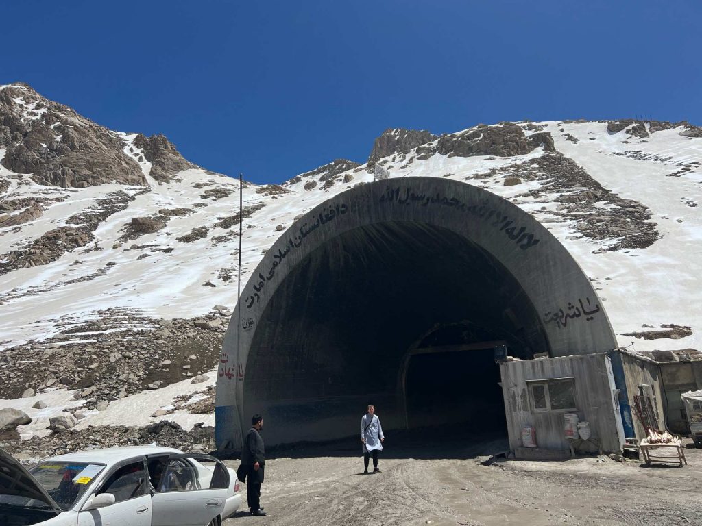 David Simpson standing near tunnel entrance in Mazar, Afghanistan. Body search, Soviet exploits & The Salang Pass