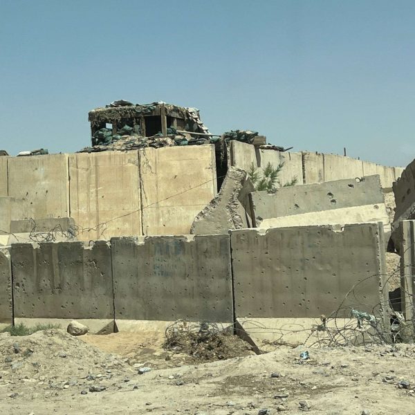Military outpost wall in Helmand, Afghanistan. Flour mill, super noodles and the Afghan Ring road