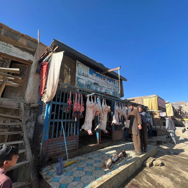 Meat hanging outside butcher shop in Mazar, Afghanistan. Body search, Soviet exploits & The Salang Pass