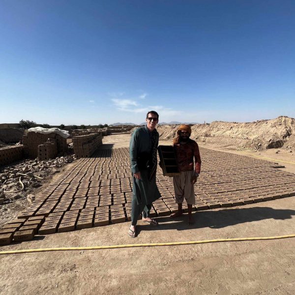 David Simpson with local brick maker at brick factory in Kandahar, Afghanistan. Sandstorm, bricks & cramps; Kabul to Kandahar