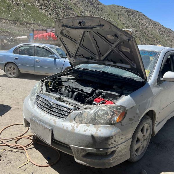 Car with open hood in Mazar, Afghanistan. Body search, Soviet exploits & The Salang Pass