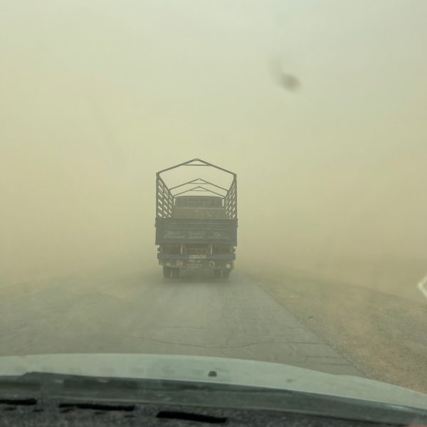 Truck in sandstorm in Kandahar, Afghanistan. Sandstorm, bricks & cramps; Kabul to Kandahar