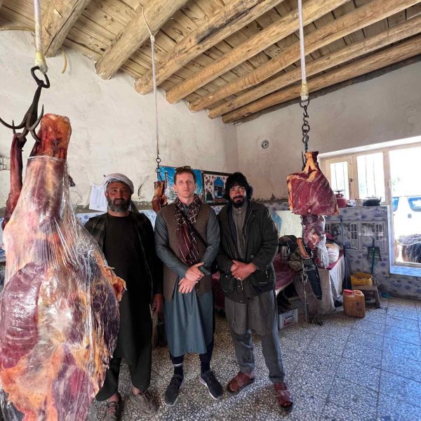 David Simpson and locals at butcher shop in Bamiyan, Afghanistan. Bamiyan, Qlukhi & The Buddhas