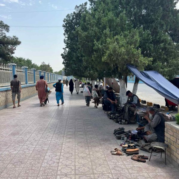 Local sandals vendors in Mazar, Afghanistan. Playing volley ball with the Taliban