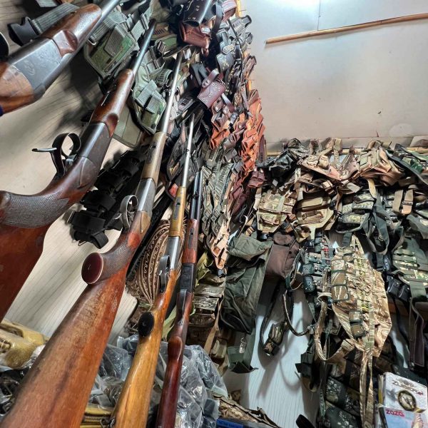 Guns and military gear at gun shop in Jalalabad, Afghanistan. Worst food poisoning, Jalalabad