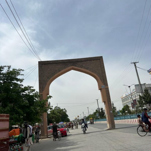 Arch on the street in Kandahar, Afghanistan. Sandstorm, bricks & cramps; Kabul to Kandahar