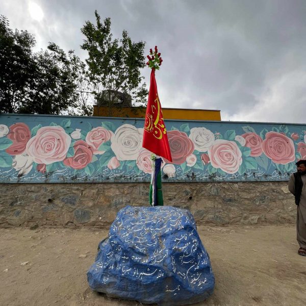 Flag on a rock in Kabul, Afghanistan. Box camera and Afghan theme park