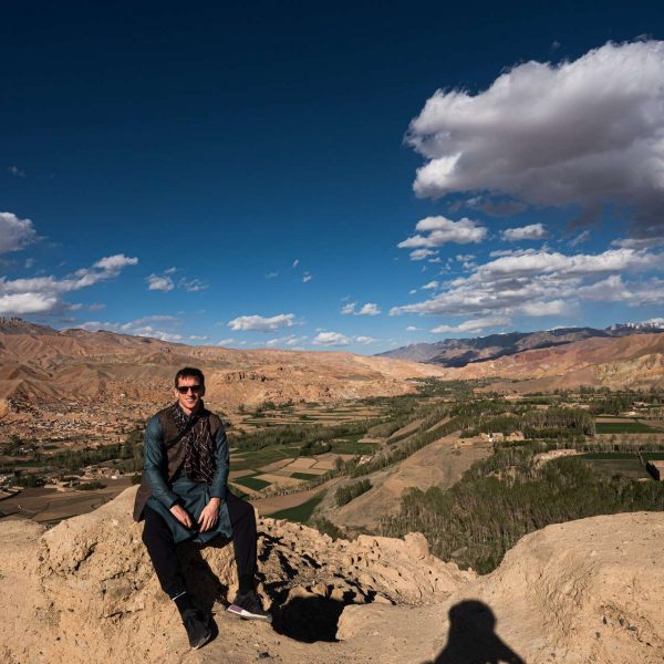 David Simpson seated in Bamiyan, Afghanistan. Bamiyan, Qlukhi & The Buddhas