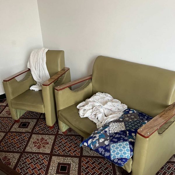 Hotel room sofa and pillow in Jalalabad, Afghanistan. Worst food poisoning, Jalalabad