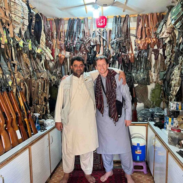 David Simpson with local guy at gun shop in Jalalabad, Afghanistan. Worst food poisoning, Jalalabad