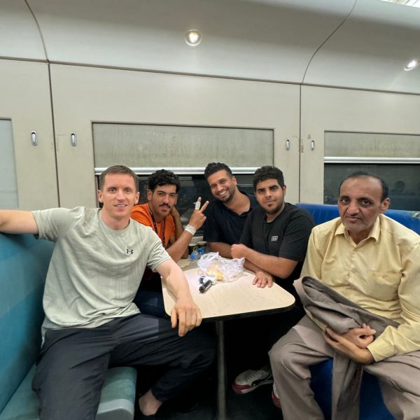 David Simpson with locals aboard the sleeper train in Iraq. Iraqi sleeper train