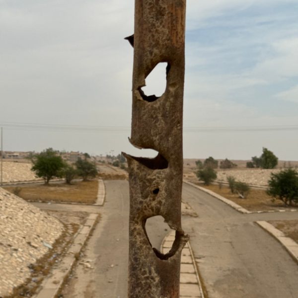 Bullet holes on metal pole at Al Awja in Iraq. Saddam’s hometown, ISIS headquarters & Mosul