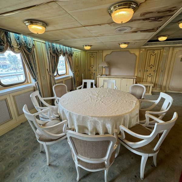 Small dining table of Basrah Breeze in Iraq. Private tour of Saddam's yacht
