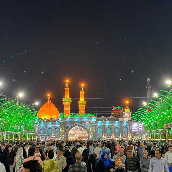 Local people at Imam Hussein shrine at night in Iraq. World’s largest cemetery & sweets
