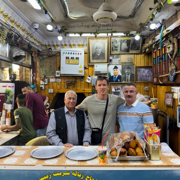David Simpson with locals inside shop in Iraq. Saddam’s Palace & old town Baghdad
