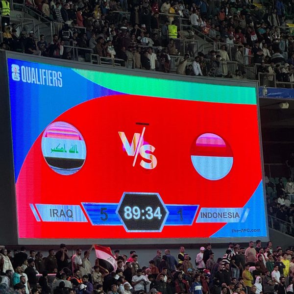 Scoreboard and spectators at stadium in Basra in Iraq. Iraq v Indonesia in Basra