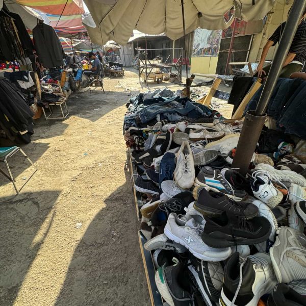 Shoes and clothes for sale at local market in Iraq. A tour around Baghdad & the Al Anbar