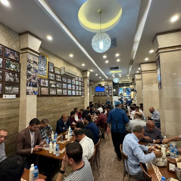 Local people eating at restaurant at Erbil market in Iraq. Saddam's torture house, Erbil & Sulaymaniyah