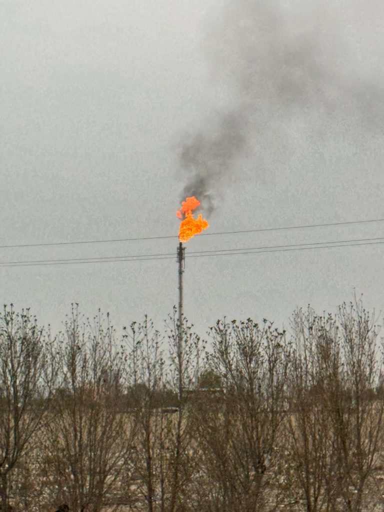 Flare stack in oil well in Basra in Iraq. The Iraqi Series reflection post